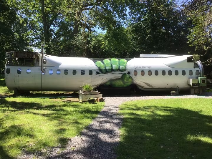 Stay in a real plane with outdoor hot tub