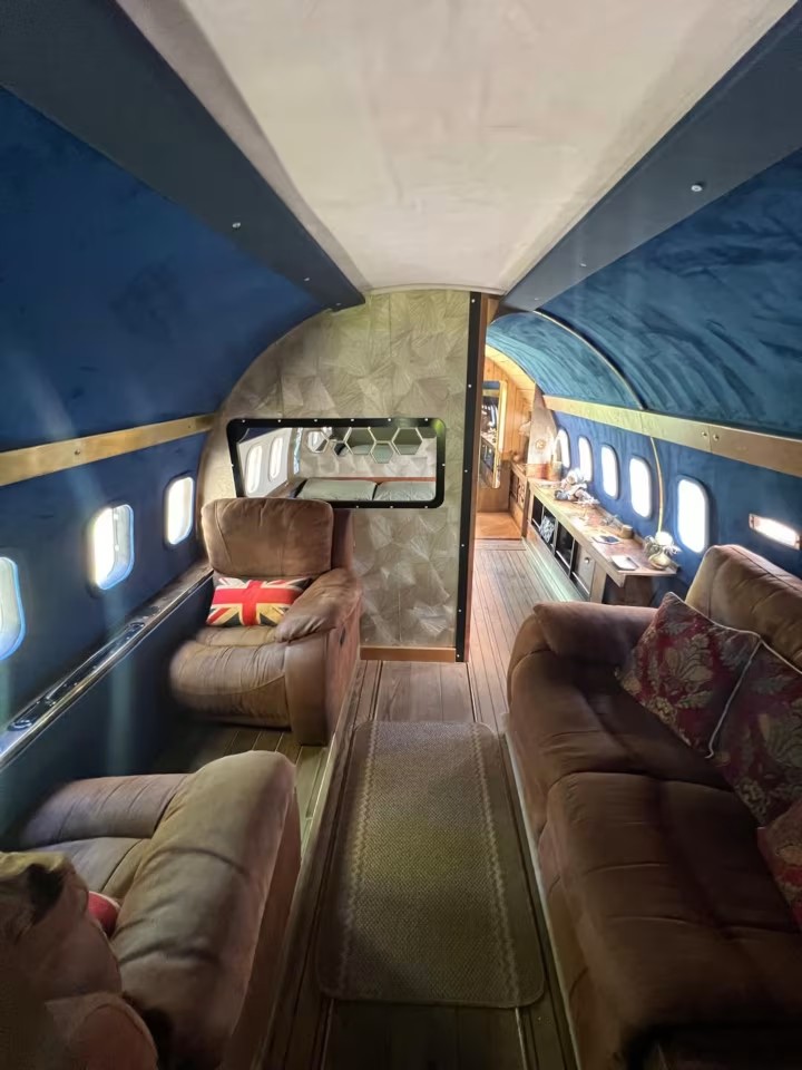 Stay in a real plane with outdoor hot tub