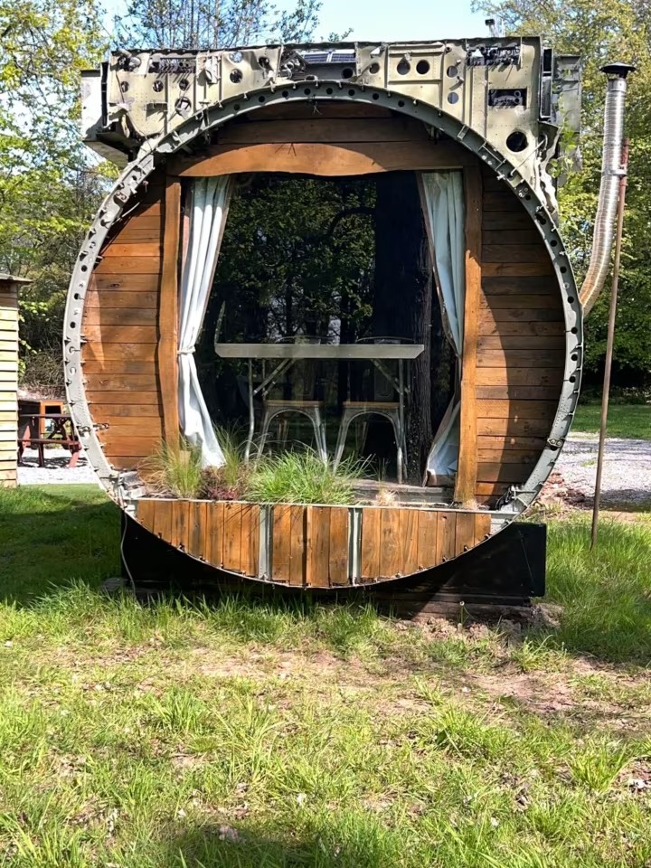 Stay in a real plane with outdoor hot tub