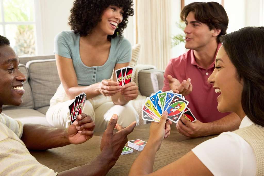 Mattel Games UNO Card Game with 2 Add On Packs with Storage Tin